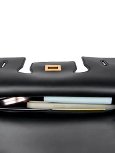 Elegant black leather handbag with gold buckle and spacious interior for daily items
