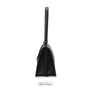 Side view of black leather underarm bag featuring dual compartments and accordion folds