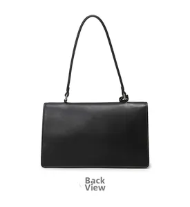 Detailed back view of minimalist black leather shoulder bag with sleek metal hardware