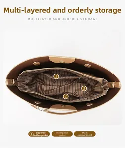 Vertical top view showing multiple inner compartments and branded lining of the tote bag