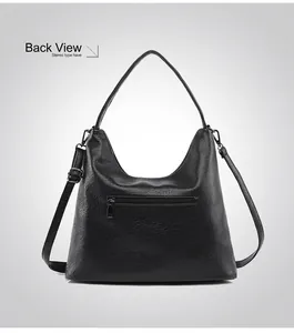 Detailed back view of a black pebbled leather tote bag with a functional zipper pocket