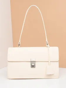 Elegant minimalist off-white leather shoulder bag with a silver metallic round lock