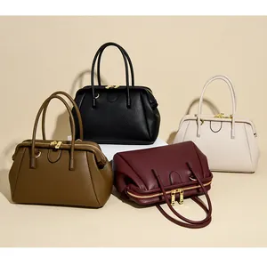 Collection of textured leather handbags in black, beige, brown and burgundy colors