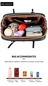 Detailed interior of black pebbled leather tote showing spacious storage and golden zipper
