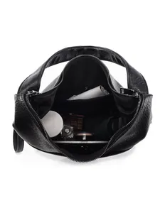 Large black leather tote bag showing spacious interior with daily essentials