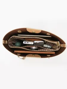 Brown leather tote bag interior view with compartments for iPad and accessories