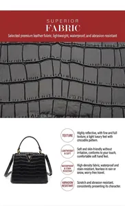 Détail macro du cuir motif crocodile noir avec un logo V doré sur le sac à main chic