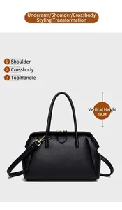 Detail view of black litchi pattern leather handbag with 13cm drop handles and gold hardware