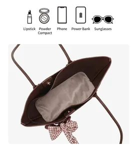Top view of brown tote bag interior with herringbone lining and daily essentials capacity icons