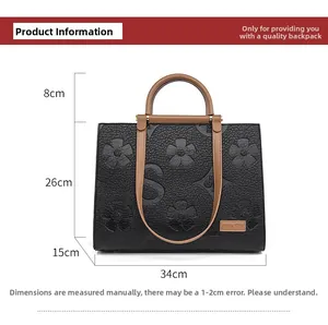 Detailed size chart of black embossed tote bag with dimensions 34x26x15cm
