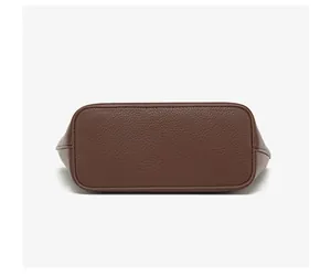 Detailed bottom view showing the premium pebbled leather texture and uniform stitching of the tote