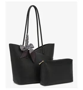 Detail of black litchi grain tote bag with decorative houndstooth silk scarf and small pouch