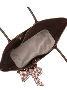 Large brown tote bag with herringbone lining and stylish houndstooth scarf on handle