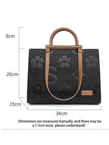 Black embossed tote bag for women with floral texture and dimensions 34x26x15cm
