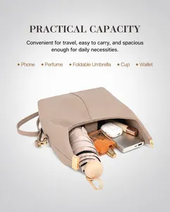 Close-up of leather handbag interior showing large capacity for umbrella and cosmetics
