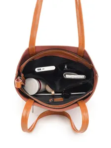 Brown leather tote bag interior view showing large capacity and multi-pocket organization