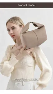 Detail of beige lychee pattern leather handbag with unique curved handle and side metal hardware