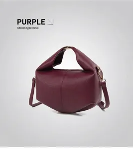Detail of purple minimalist bag featuring premium lychee grain leather and gold hardware