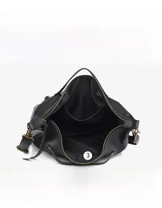 Internal structure of black pebbled leather tote bag with main compartment and pockets