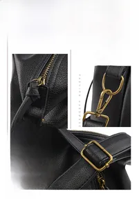 Detail of adjustable detachable strap with bronze hardware on black lychee grain leather bag