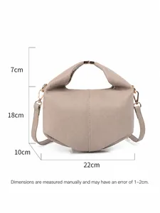 Litchi pattern leather crossbody bag in taupe with gold metal handle and 22cm width size