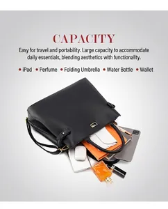 Top view of large black tote bag showing spacious orange interior with daily essentials