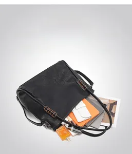 Large black pebbled leather tote bag showing spacious interior for iPad and essentials