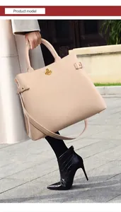 Detail of beige tote bag with golden twist lock and textured soft leather finish