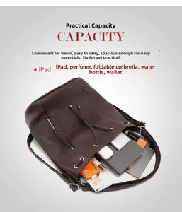Deep brown pebble leather backpack showing capacity for iPad, perfume and notebook
