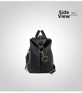 Side view of black pebble leather tote bag showing stylish silhouette and gold hardware