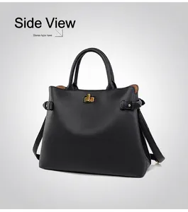 Detail of classic black leather tote bag with gold twist-lock and lychee texture