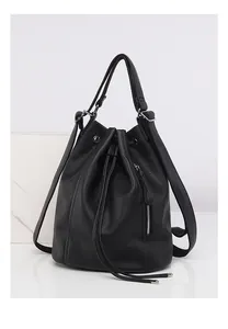Detail of black lychee grain leather backpack featuring drawstring and side zipper