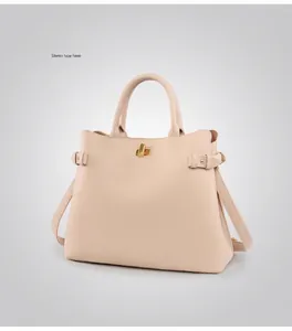 Detail view of the structured apricot soft leather tote bag with metallic twist lock