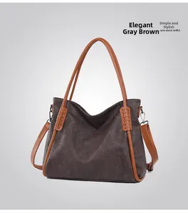 Detail view of the elegant grey brown tote bag showing textured faux leather and strap hooks