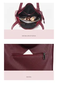 Detail view showing spacious interior pockets and back zipper pocket of burgundy leather tote