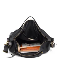 Large black pebbled leather tote bag with spacious interior and multiple compartments