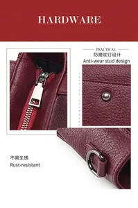 Detail of burgundy lychee leather tote with silver zippers and protective metal feet