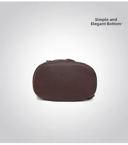 Detailed bottom view of large capacity faux leather backpack with litchi grain texture