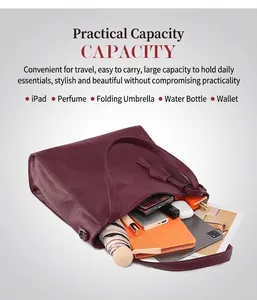 Macro view of burgundy leather tote bag showing large capacity for iPad and daily essentials