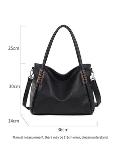 Large black tote bag with braided handles and detachable strap shown in 36cm width
