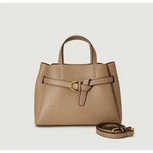 Detail of lychee pattern leather tote bag with decorative belt buckle and top handle