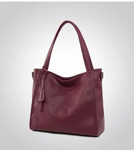 Side view of dark burgundy tote bag featuring premium lychee grain leather texture