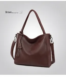 Detailed view of coffee brown tote bag with premium lychee grain texture and shoulder strap