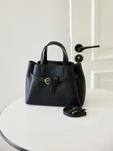 Minimalist black lychee pattern leather handbag with gold ring buckle and shoulder strap