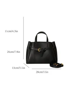 Black textured leather handbag with dimensions 28x20x13cm and gold ring hardware