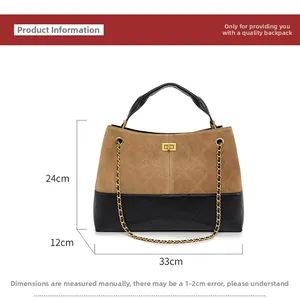 Detailed view of brown matte quilted handbag with dimensions 33cm wide and 24cm high