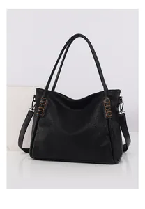Detail of black pebbled leather tote featuring brown contrast hand-woven stitching on strap