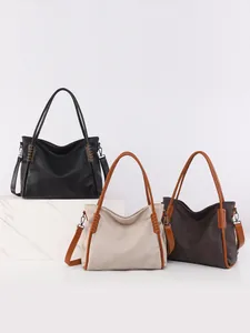 Three minimalist large capacity tote bags in black, beige, and brown with woven side details