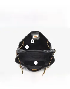 Macro view of the internal structure with a zipper pocket in this black woven bucket bag