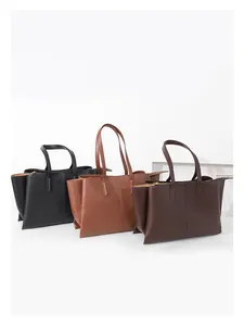 Three premium leather tote bags in black and brown shades with minimalist stitching detail